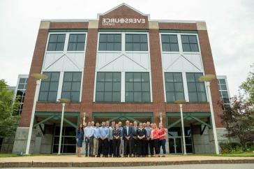 UNH graduates gather outside of Eversource in Manchester.